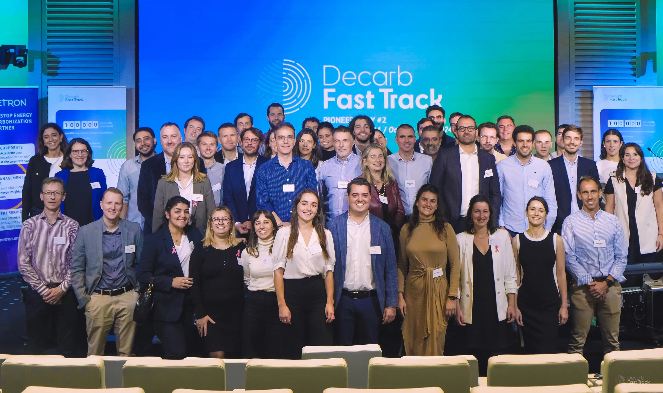 Staff gathered on stage for a group photo